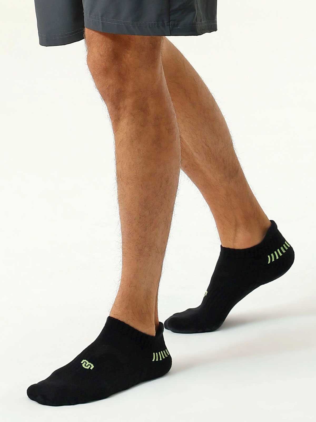 CloseMate men's white cushioned athletic ankle socks shown on feet, highlighting arch support and snug fit.
