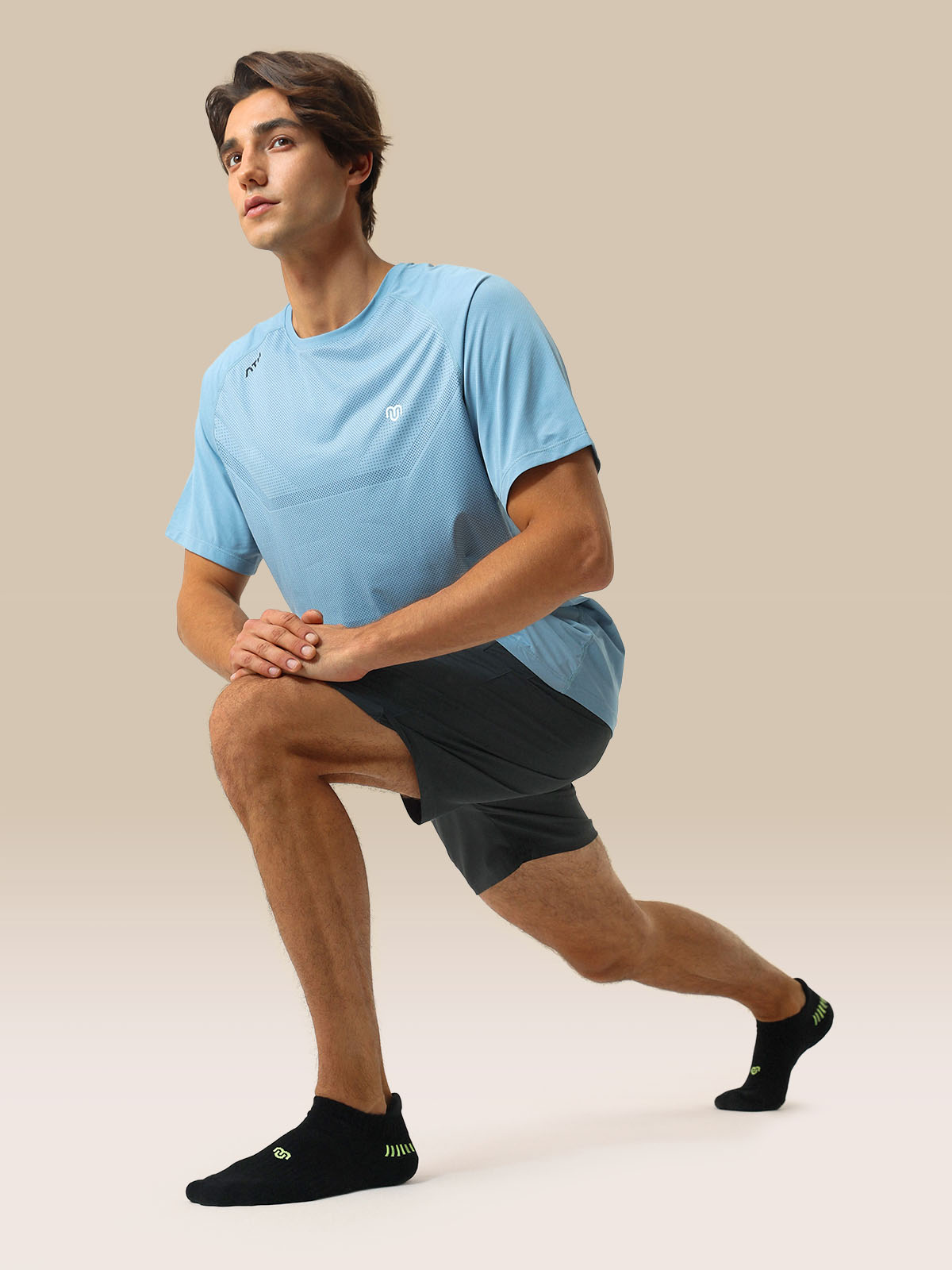 CloseMate men's white cushioned athletic ankle socks shown on feet, highlighting arch support and snug fit.