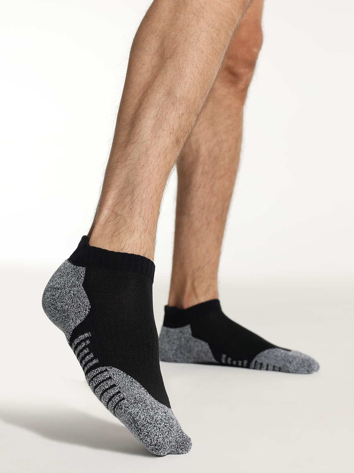 Soft athletic fabric detail on black men’s socks