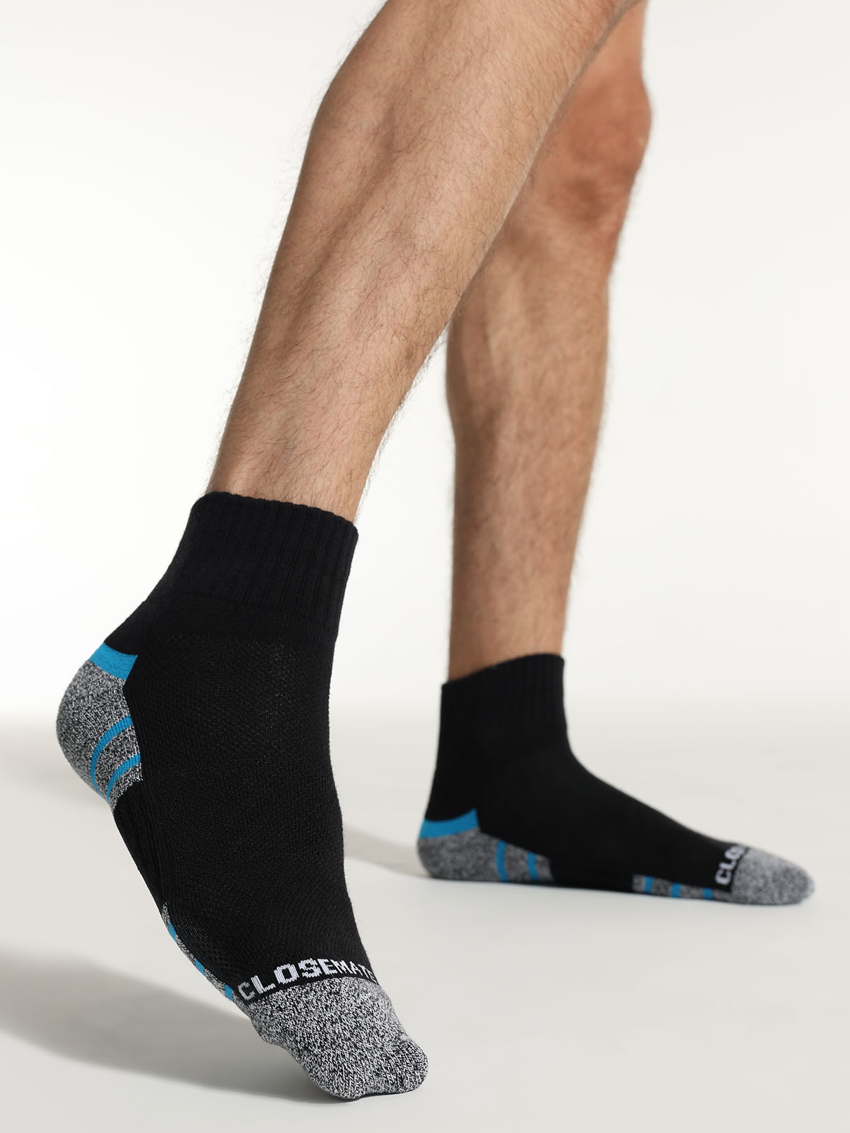 men wearing black blue cushioned socks during workout