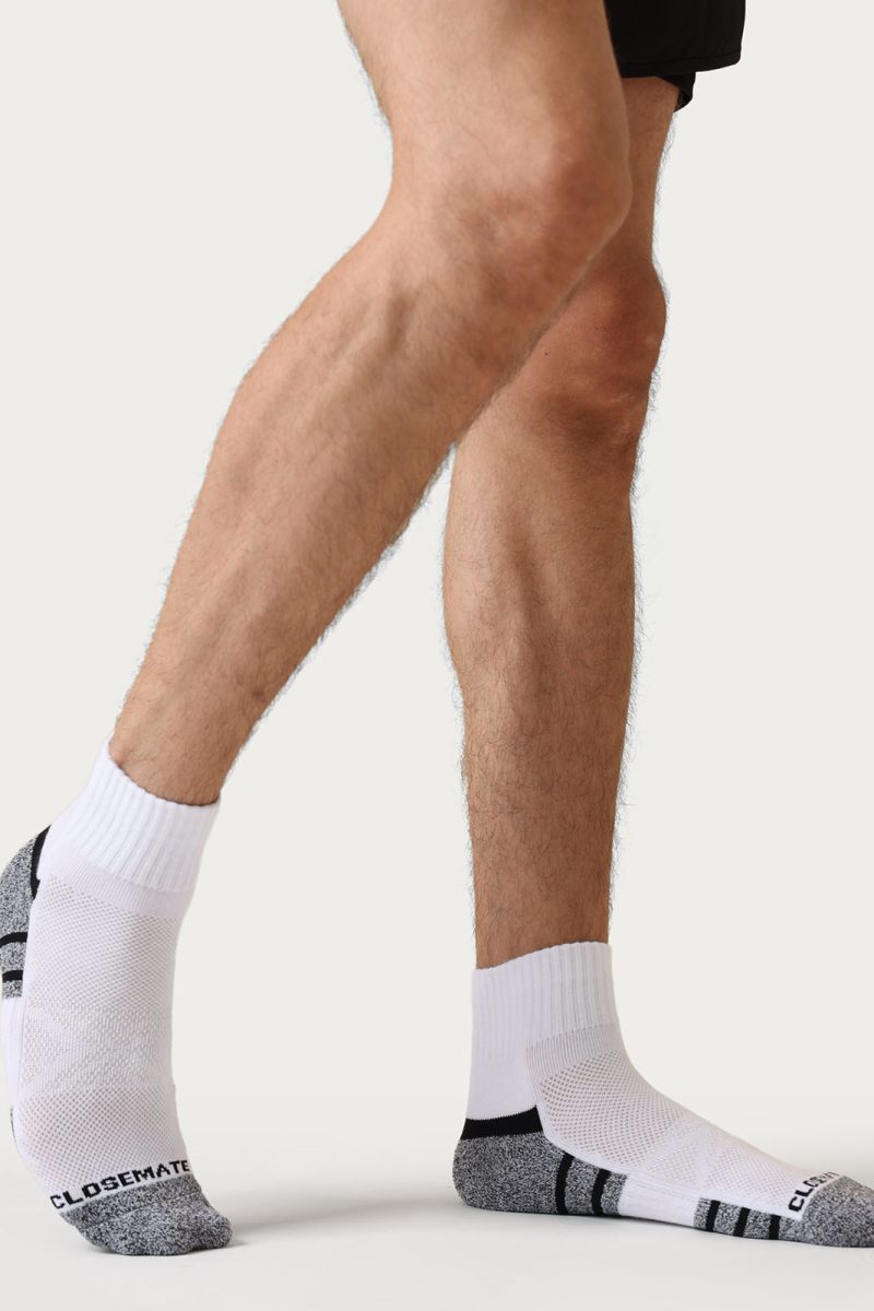 Close-up of cushioned sole on white athletic crew socks