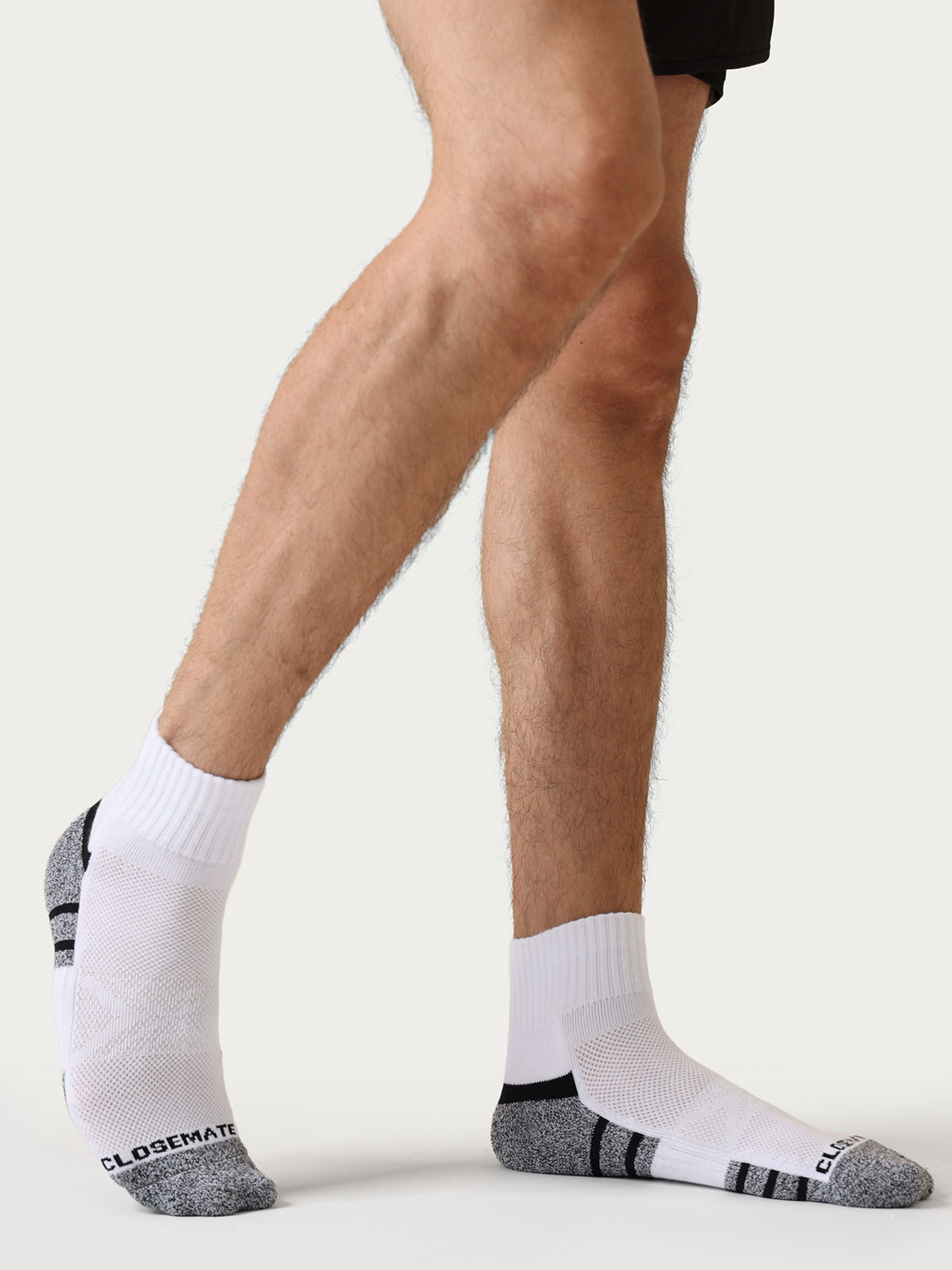 Close-up of cushioned sole on white athletic crew socks