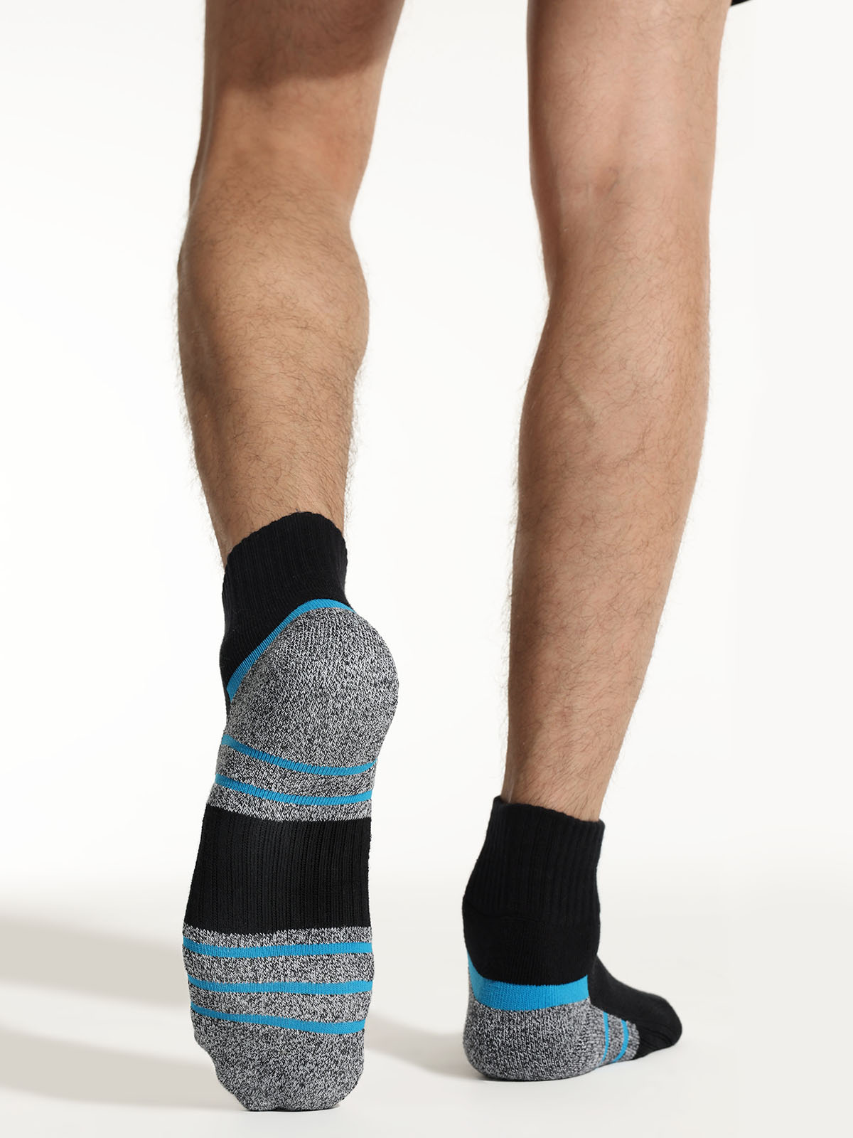 men wearing black blue cushioned socks during workout