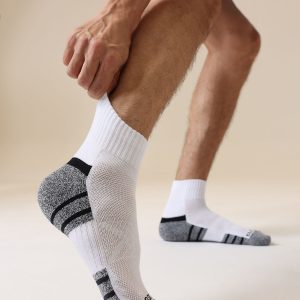 Close-up of cushioned sole on white athletic crew socks