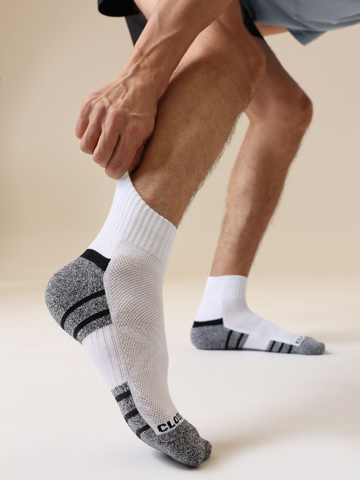 Close-up of cushioned sole on white athletic crew socks